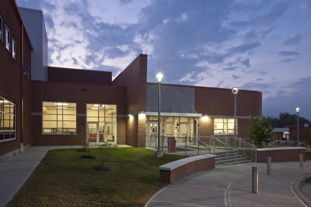 The new two-story math and science wing addition, created the opportunity to significantly change the appearance of the school, by creating a new entrance and entry lobby.