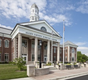 The brick and limestone exterior incorporates traditional design elements of fluted limestone columns, corner “towers”, stone quoins and arched window transoms.