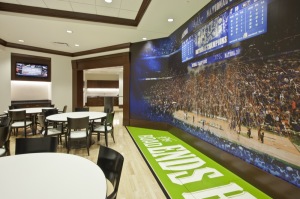 The famed sideline “the road stops here” is partnered with one wall completely covered by a photograph of the New Orleans court just after UK won the Championship in the new players’ lounge and dining area